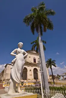Plaza Mayor Prints: Statue in front of the Plaza Mayor with Iglesia Parroquial de la Santisima Trinidad