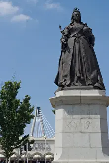 Queen Victoria Prints: Statue of Queen Victoria with Millennium Bridge in the background, Southport