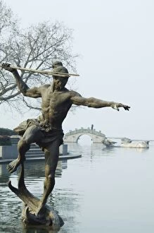 Images Dated 7th January 2008: Statue of a spear fisherman in the waters of West Lake, Hangzhou, Zhejiang Province