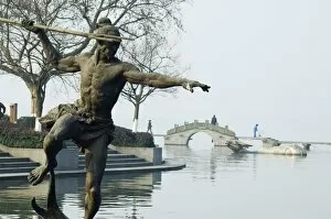 Images Dated 7th January 2008: Statue of a spear fisherman in the waters of West Lake, Hangzhou, Zhejiang Province