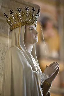 Foreground Focus Gallery: Statue of Virgin Mary wearing crown inside parish church, Saint-Thegonnec, Finistere