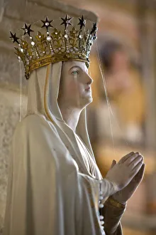 French Culture Gallery: Statue of Virgin Mary wearing crown inside parish church, Saint-Thegonnec, Finistere