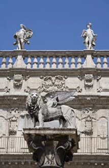 Statue of winged Venetian lion in front of Palazzo Maffei, Verona, Veneto, Italy, Europe