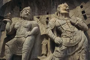 Hunan Prints: Statues carved in the rock at the Longmen Buddhist caves at Luoyang