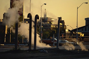 Michigan Prints: Steam escaping from below street at dusk