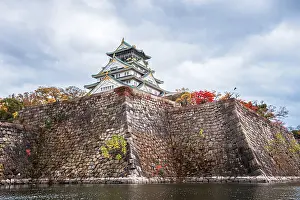 Historical Site Prints: Steep castle moat walls and waters with autumnal colors in fall, Osaka, Hoshu, Japan, Asia