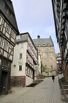 Hesse Prints: Steep narrow street in medieval city of Marburg, Hesse, Germany, Europe