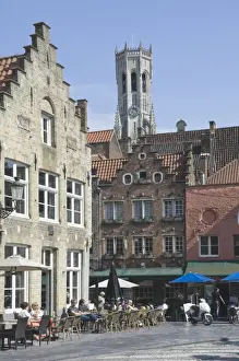 Brugge Prints: Stepped Flemish gables over street cafes with the Belfry by the Market Square behind