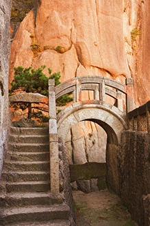 Intersecting Prints: Steps, bridge, and last sunrays on rock face, White Cloud scenic area, Huang Shan