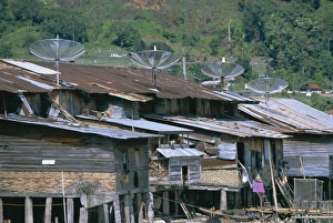 Stilt House Prints: Stilt houses with satellite dishes