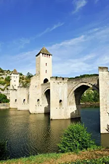 Sights Prints: Stone arch bridge crosses Lot River in Cahors, France, built in the 14th century