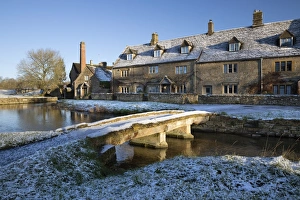 Stone bridge and Cotswold cottages in snow, Lower Slaughter, Cotswolds, Gloucestershire