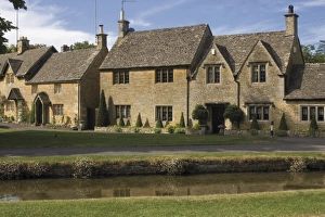 Stone cottages along the banks of the River Eye, Lower Slaughter, The Cotswolds