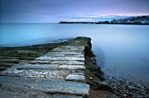 P Ier Prints: Stone jetty and new pier at dawn, Swanage, Dorset, England, United Kingdom, Europe