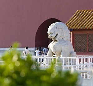 A stone lion greets visitors at the main entrance gate to The Forbidden City