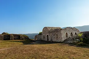 Albania Prints: Stone remains of a Byzantine church within Kala Castle surrounded by hills in Berat County Albania