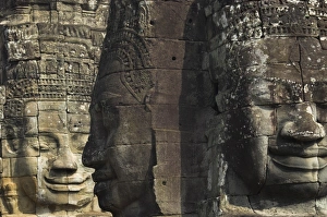 Regent Prints: Stone statuary of human faces, Ta Prohm temple, Angkor, UNESCO World Heritage Site