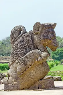 Stone Sculpture Prints: Stone statue of a mythical creature among ruins in the grounds of the mid 13th century Sun Temple