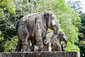 Serene Environment Prints: Stone statues of elephants among ruins in the grounds of the mid 13th century Sun Temple