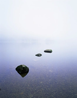 Three stones on the edge of Grasmere, Lake District National Park, Cumbria