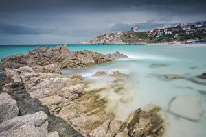 Province Of Sassari Prints: Storm clouds frame the village overlooking the turquoise sea, Santa Teresa di Gallura