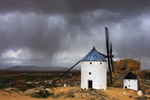 Meteorological Prints: Storm clouds on windmills and castle, Consuegra, Don Quixote route, Toledo province