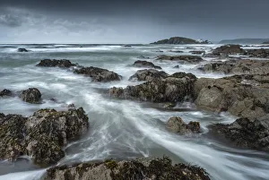 Stormy conditions on the rocky Bantham coast, looking across to Burgh Island, Devon