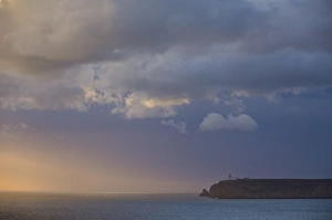 Images Dated 20th March 2008: Stormy sunset over Atlantic ocean and cliffs at Cape St. Vincent with lighthouse in the distance