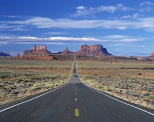 Straight road heading for Monument Valley, Navajo Reserve, on border of Arizona and Utah