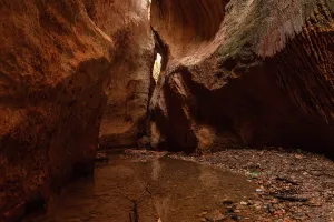 Granada Prints: Stream flows through red-rock corridors in Barranco de Luna