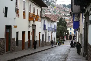 Cobbled Prints: Side street in centre of Cusco City with outskirts of city on hill beyond, Cuzco