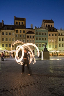 Street performers in front of houses