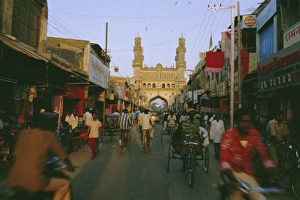 Rick Shaw Prints: Street scene with bicycles and rickshaw and the Char Minar