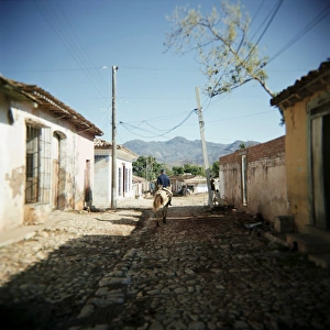 Horse Back Prints: Street scene with man on horseback, Trinidad, Cuba, West Indies, Central America