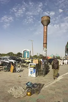 Afgani Prints: Street scene near Shrine of Hazrat Ali with Memorial plaque of assassinated Mujahadin leader Ahmad Shah Massoud know as