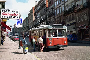 Porto Prints: Street scene of people getting on a trolley bus in