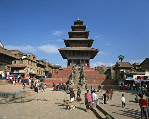 Street scene with the Siddhi Lakshmi Temple with its tiered roof