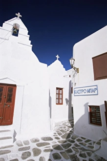 Mikonos Prints: Street scene with whitewashed buildings