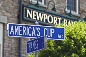 Street sign reflecting Newports sailing and historic heritage at the junction of Americas Cup Avenue