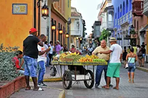 Lively Prints: Street vendor of fruits inside the downtown colonial walled city