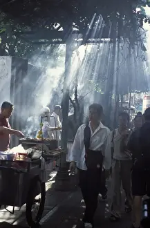 Market Vendor Prints: Street vendors selling grilled meat to passers-by on train platform