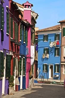 A street with washing drying at windows, Burano Island, Venice, Veneto, Italy, Europe
