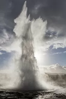 Geothermal Gallery: Strokkur Geysir erupting against stormy sky, Geysir, South West Iceland, Polar Regions
