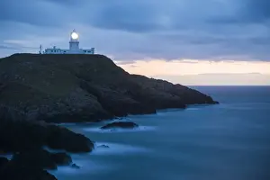 Security Prints: Strumble Head Lighthouse at dusk, Pembrokeshire Coast National Park, Wales, United Kingdom