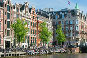 Outdoor Seating Prints: Students sitting by Rokin canal, Amsterdam, The Netherlands, Europe