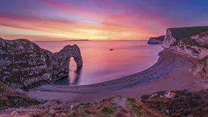 A stunning sunset over Durdle Door on the Jurassic Coast, UNESCO World Heritage Site