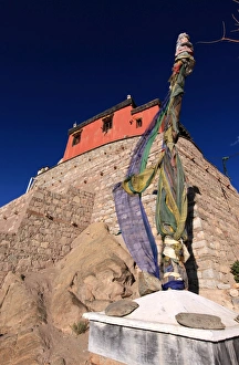 Images Dated 1st January 2000: A stupa bound with prayer flags stands under the walls of Leh Palace, Leh