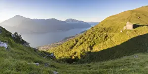 Lake Como Prints: Sun on Church of San Bernardo lights up the landscape around the blue water of Lake Como at dawn