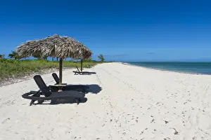 Sun Lounger Prints: Sun lounger on a white sand beach in northern Providenciales, Turks and Caicos, Caribbean