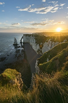 Etretat Prints: Sun rays at dawn at the cliffs, Etretat, Normandy, France, Europe